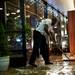 A friend of the store helps remove water from Renaissance in Ann Arbor on Tuesday. Daniel Brenner I AnnArbor.com